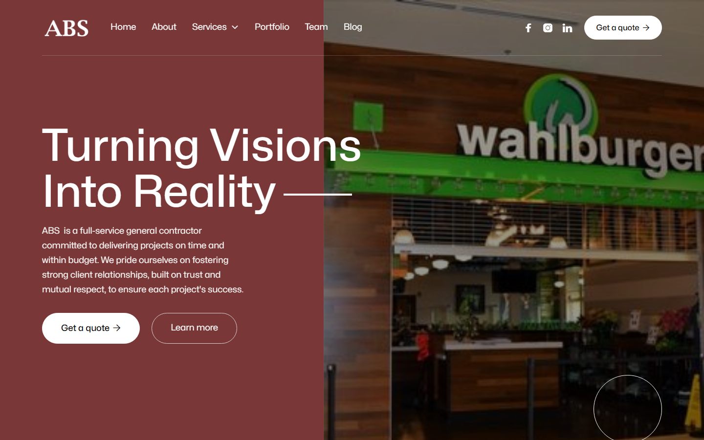 Homepage of absbuildingintegrators.com with the headline Turning Visions Into Reality over a Wahlburgers build-out